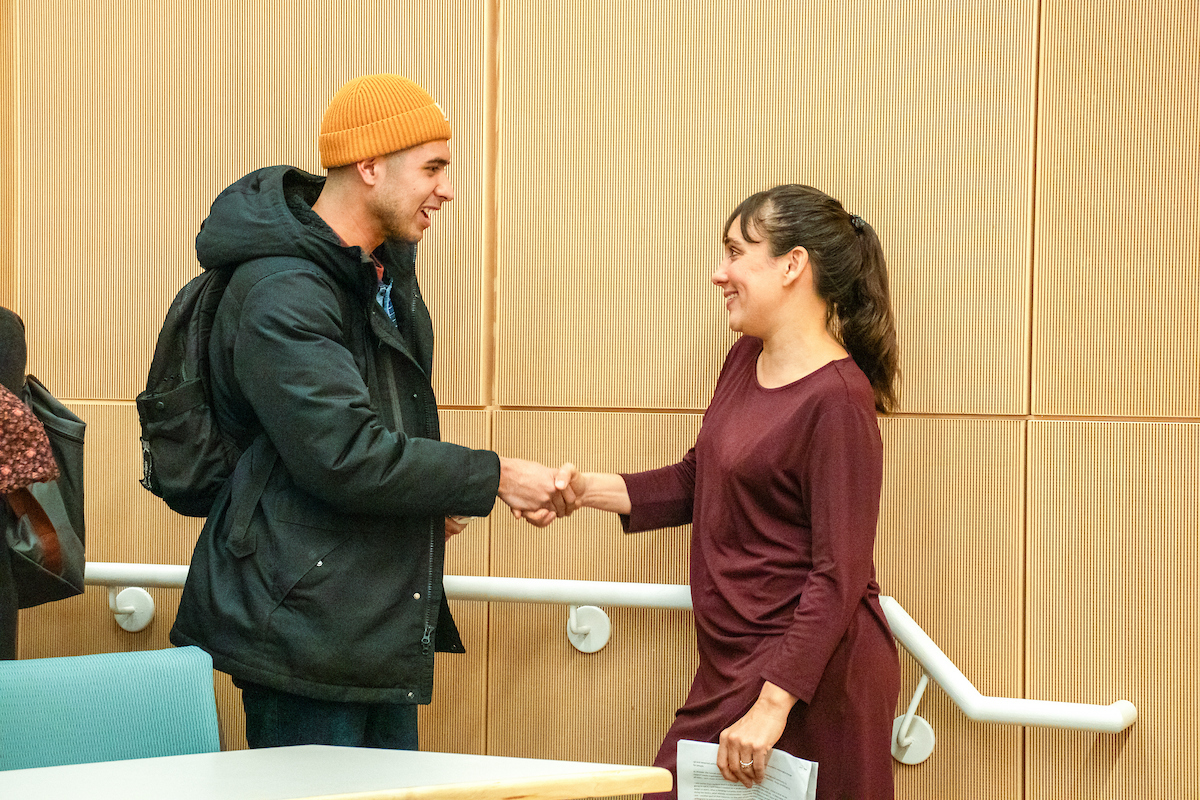 Ottaway shaking students hand